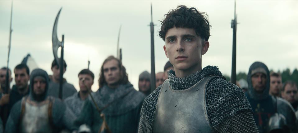 This image released by Netflix shows Timothée Chalamet, center, in a scene from "The King." (Netflix via AP)