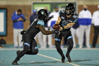 Coastal Carolina quarterback Grayson McCall, right, hands the ball off to CJ Marable during the first half of an NCAA college football game against BYU Saturday, Dec. 5, 2020, in Conway, S.C. (AP Photo/Richard Shiro)