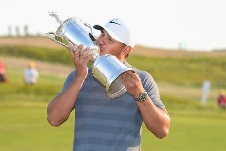 Jun 17, 2018; Southampton, NY, USA; Brooks Koepka kisses the trophy after winning in the final round of the U.S. Open golf tournament at Shinnecock Hills GC - Shinnecock Hills Golf C. Dennis Schneidler-USA TODAY Sports