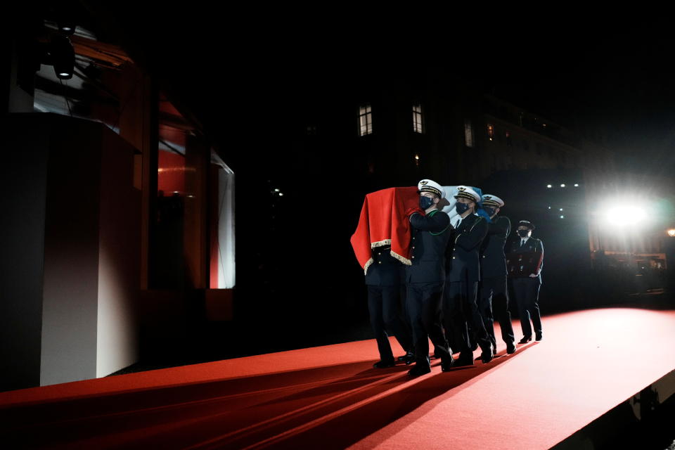 Six carriers of the French Air and Space Force carry the cenotaph of Josephine Baker, covered with the French flag and followed by a female aviator holding a cushion with her decorations, during her induction ceremony into the Pantheon in Paris, France, November 30, 2021. Thibault Camus/Pool via REUTERS