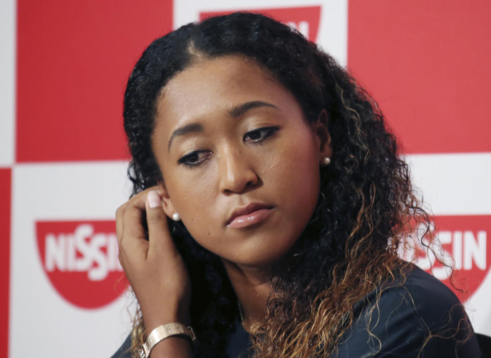 U.S. Open women's singles champion Naomi Osaka attends a Press conference in Yokohama, south of Tokyo, Thursday, Sept. 13, 2018. Osaka defeated Serena Williams of the U.S. on Saturday, Sept. 8, to become the first Grand Slam singles champion from Japan.(AP Photo/Koji Sasahara)