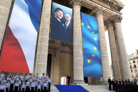 French President Emmanuel Macron stands outside the Pantheon before delivering a speech in tribute to late Auschwitz survivor and French health minister Simone Veil and her late husband Antoine Veil during a national tribute before being laid to rest in the crypt of the Pantheon mausoleum, in Paris, France, July 1, 2018 Ludovic Marin/Pool via Reuters