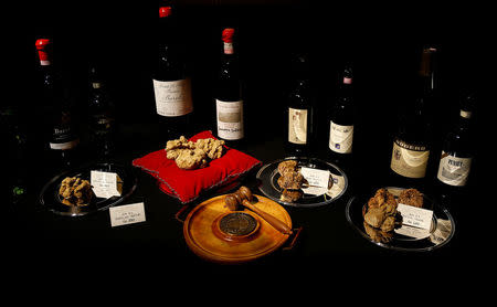 Barolo and Barbaresco red wine bottles and set of truffles are seen prior to the international auction for truffles at the Grinzane Castle in Grinzane Cavour near Alba, Italy, November 12, 2017. REUTERS/ Stefano Rellandini