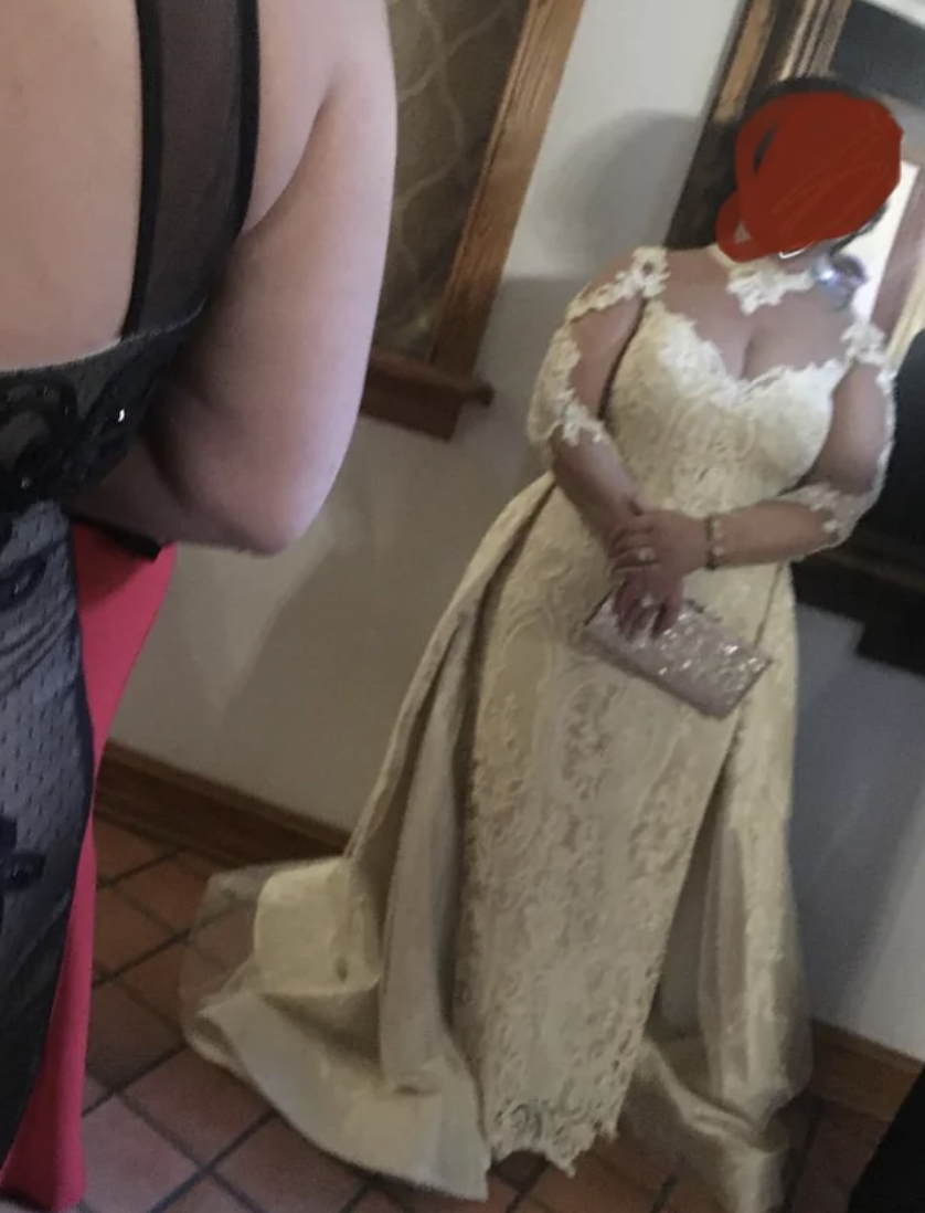 A woman who isn't the bride wearing a wedding dress