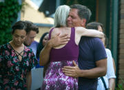 <p>Don Damond, the fiance of Justine Damond, is comforted outside his home as demonstrators march by during the Peace and Justice March for Justine, Thursday, July 20, 2017, in Minneapolis, Minn. (Photo: Aaron Lavinsky/Star Tribune via AP) </p>