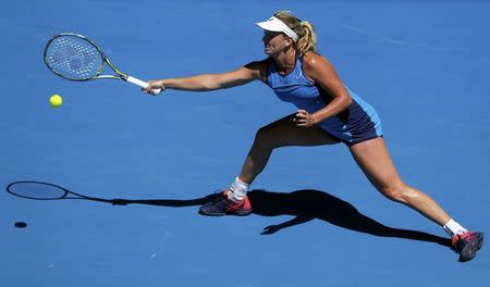 Tennis - Australian Open - Melbourne Park, Melbourne, Australia - 24/1/17 Coco Vandeweghe of the U.S. hits a shot during her Women's singles quarter-final match against Spain's Garbine Muguruza. REUTERS/Jason Reed