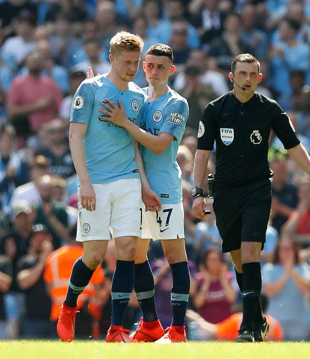 Phil Foden embraces team-mate Kevin De Bruyne