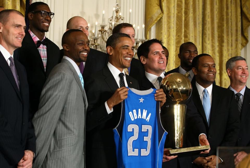 <div class="inline-image__caption"><p>President Barack Obama is flanked by owner Mark Cuban and members of the Dallas Mavericks during an event to honor the NBA champions in the East Room at the White House on January 9, 2012, in Washington, D.C.</p></div> <div class="inline-image__credit">Mark Wilson/Getty</div>