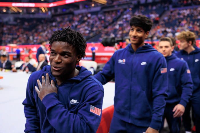 Frederick Richard, left, leaves the floor after open stretch during the Trials.<span class="copyright">Nikolas Liepins—Anadolu/Getty Images</span>