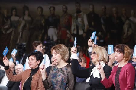 Members of the initiative group to nominate Vladimir Putin as a candidate in the 2018 presidential election attend a meeting in Moscow, Russia December 26, 2017. REUTERS/Sergei Karpukhin