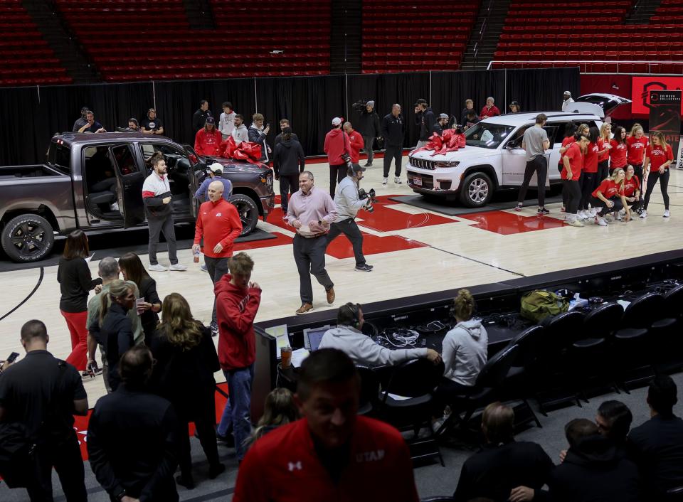 Members of the women’s gymnastics and men’s and women’s basketball programs look at 2024 Ram 1500 Big Horn Night Edition and a 2024 Jeep Grand Cherokee L Limited Edition at the Huntsman Center in Salt Lake City on Wednesday, Dec. 13, 2023. A vehicle lease deal was made available to the athletes as part of a Name, Image and Likeness (NIL) deal. | Laura Seitz, Deseret News
