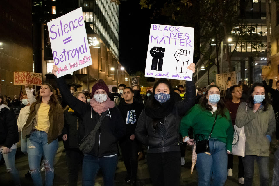 SYDNEY, AUSTRALIA - JUNE 02: Protesters march and hold up signs at Martin Place during a 'Black Lives Matter' rally on 02 June, 2020 in Sydney, Australia. This event was organized to rally against aboriginal deaths in custody in Australia as well as in unity with protests across the United States following the killing of an unarmed black man George Floyd at the hands of a police officer in Minneapolis, Minnesota. (Photo by Speed Media/Icon Sportswire)