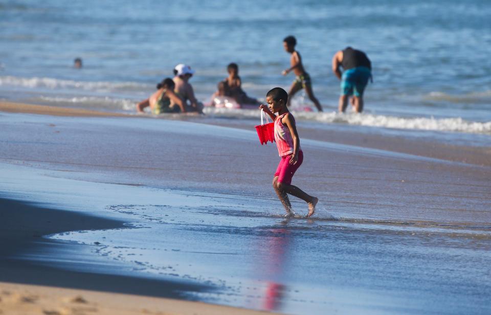 A beach-goer takes advantage of a gentle surf at Rehoboth Beach as sunny weather brought crowds to the Delaware beaches, Saturday, August 21, 2022.