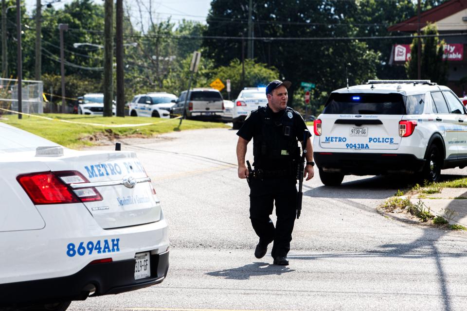 Metro Nashville Police Officers investigate after an officer was shot in Nashville, Tenn., on June 1, 2023. The officer was taken to Vanderbilt University Medical Center for treatment.