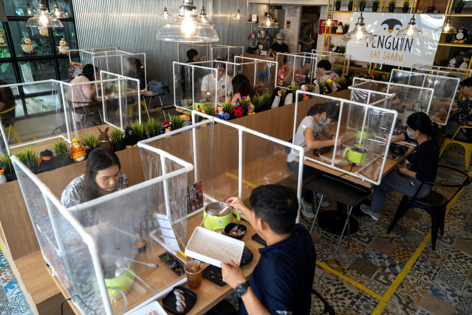 People lunch at the Penguin Eat Shabu hotpot restaurant in Bangkok, Thailand.