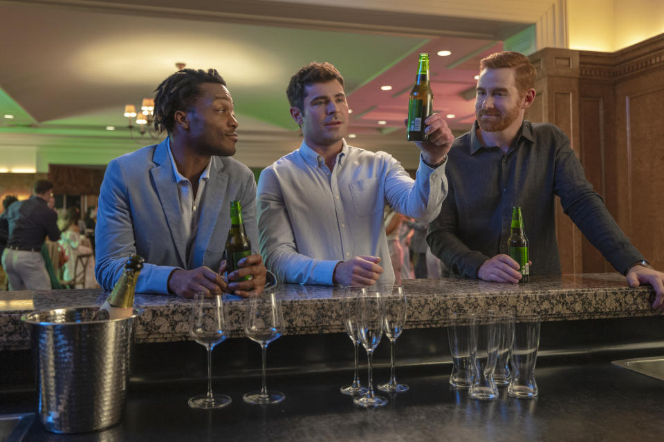 This image released by Amazon Prime shows, from left, Jermaine Fowler, Zac Efron and Andrew Santino in a scene from "Ricky Stanicky." (Ben King/Amazon via AP)