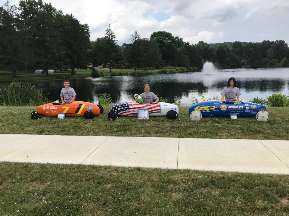 Hudson Stull (left), Savannah Blind and Lauren Brown competed in the Tuscarawas County Soap Box Derby.