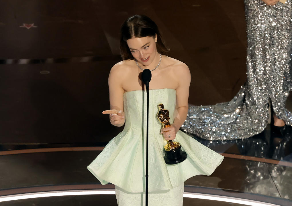 HOLLYWOOD, CALIFORNIA - MARCH 10: Emma Stone accepts the Lead Actress award for 