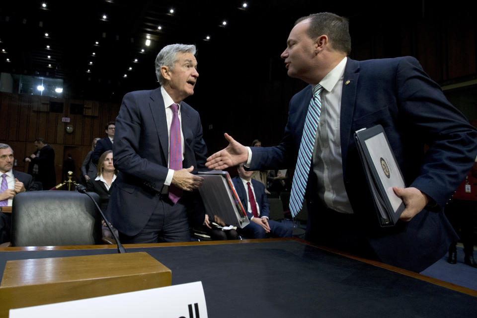 Federal Reserve Board Chair Jerome Powell shake hands with Chairman of the Congress Joint Economic Committee Sen. Mike Lee, R-Utah, during the hearing on the economic outlook, on Capitol Hill in Washington, on Wednesday, Nov. 13, 2019. (AP Photo/Jose Luis Magana)