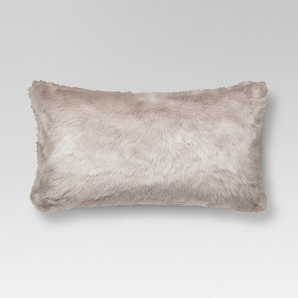 Get it <a href="https://www.target.com/p/faux-fur-oversized-lumbar-pillow-threshold-153/-/A-52968220#lnk=newtab" target="_blank">here</a>.&nbsp;