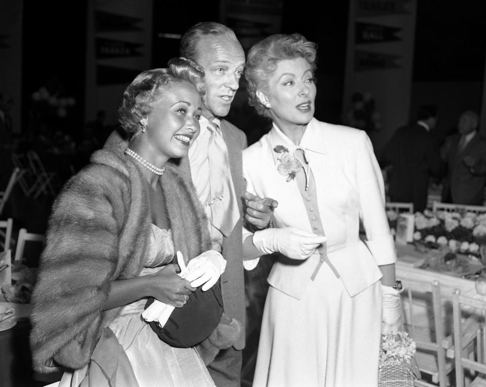 FILE - In this Sept. 9, 1953 file photo, Jane Powell, left, Fred Astaire, center and Greer Garson pose for a photo in Los Angeles. Jane Powell, the bright-eyed, operatic-voiced star of Hollywood's golden age musicals who sang with Howard Keel in “Seven Brides for Seven Brothers” and danced with Fred Astaire in “Royal Wedding,” has died. Thursday, Sept. 16, 2021. She was 92. (AP Photo/Ellis Bosworth, File)