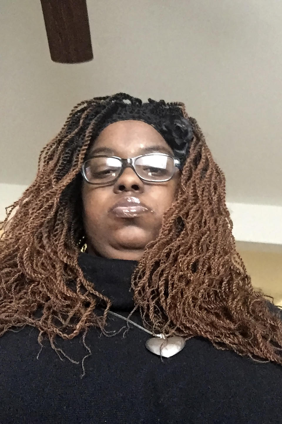 FILE - In this 2020 file photo provided by Ruqayyah Bailey, Ruqayyah Bailey, of St. Louis County, Mo., poses for a selfie. Bailey has lost much of her independence and wants to get her life back on track. Bailey, 31, has autism. Until March, she lived in her own apartment, worked part time as a cashier at a St. Louis cafe, and attended college. The coronavirus tossed all that structure out the window. Bailey could no longer get the one-on-one tutoring that helped her thrive in college. The cafe closed. With no money coming in, she moved back in with her mother. (Ruqayyah Bailey via AP, File)
