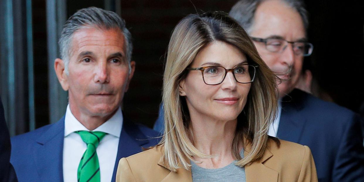 FILE PHOTO: Actor Lori Loughlin, and her husband, fashion designer Mossimo Giannulli, leave the federal courthouse after facing charges in a nationwide college admissions cheating scheme, in Boston, Massachusetts, U.S., April 3, 2019. REUTERS/Brian Snyder/File Photo