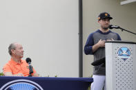 Houston Astros' Alex Bregman, right, delivers a statement as Astros owner Jim Crane listens during a news conference before the start of the first official spring training baseball practice for the team Thursday, Feb. 13, 2020, in West Palm Beach, Fla. (AP Photo/Jeff Roberson)