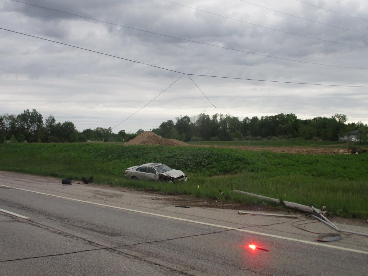 A Lexus ES is shown in a field after its driver reportedly fell asleep, drove of State Route 14 in Streetsboro and struck a utility pole Thursday morning. Only minor injuries were reported.
