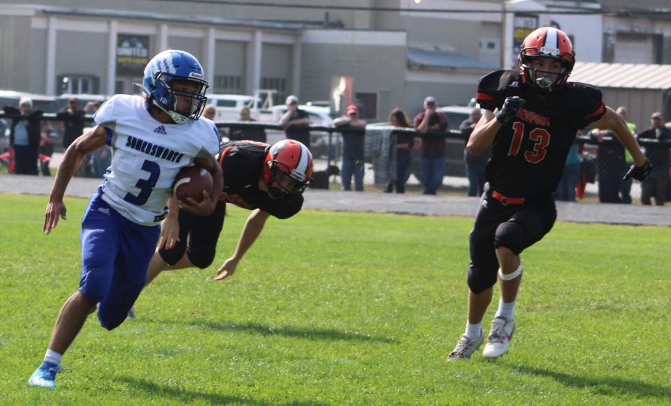 Somersworth's Kayden Bickford races towards the end zone to finish a 25-yard touchdown run early in the fourth quarter in Saturday's 13-12 loss at Newport.
