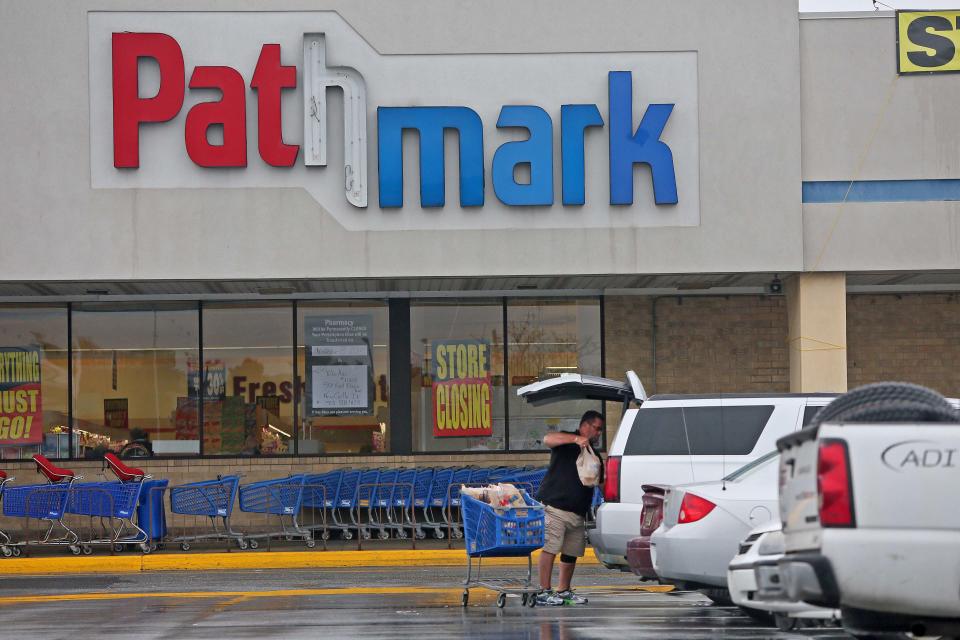 James Johnson, a loyal customer of Pathmark, unloads groceries after shopping at the Airport Plaza shopping center off North Du Pont Highway (U.S. 13), near New Castle. The Pathmark is in the process of liquidating merchandise before closing its doors.