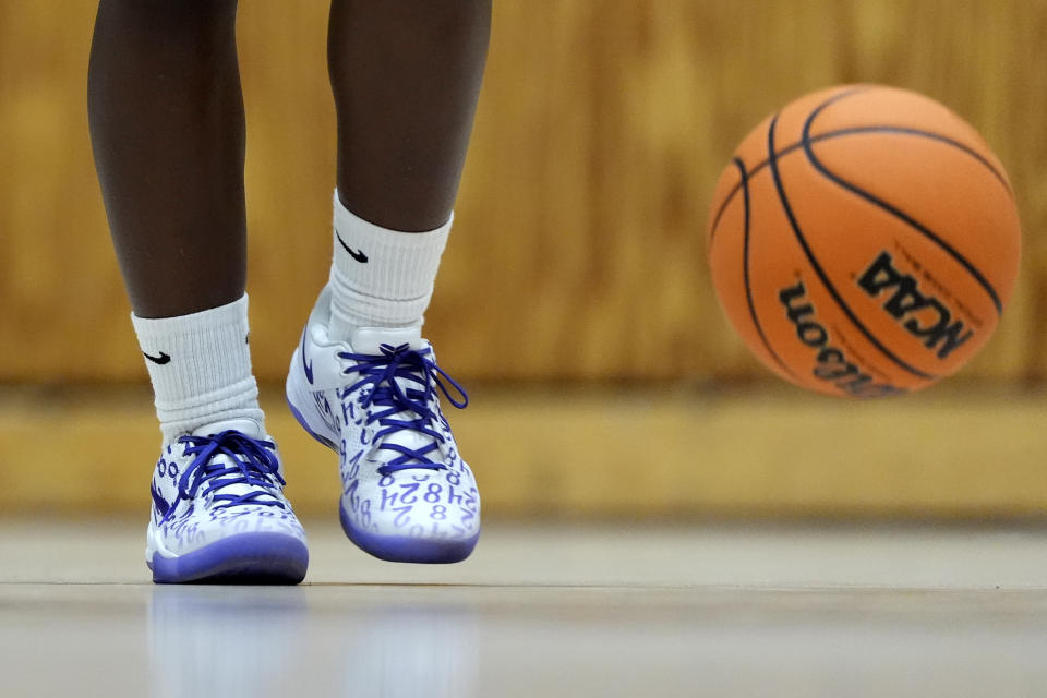 Shay Ijiwoye, who played basketball at Desert Vista High in Phoenix and has committed to Stanford University, works out Monday, March 18, 2024, in Chandler, Ariz. Iowa’s Caitlin Clark has reshaped women's college basketball and the perception of it. Up-and-coming players have taken notice, working to extend their range to be like her. (AP Photo/Matt York)