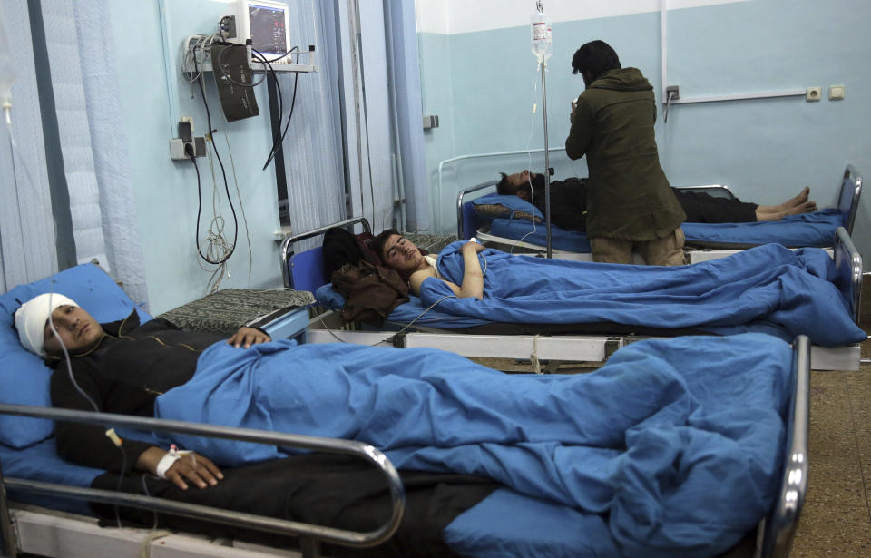 Wounded men lie on beds in a hospital in Kabul, Afghanistan, Monday, Jan. 14, 2019. Afghan officials say multiple people were killed when a suicide bomber detonated a vehicle full of explosive in the capital Kabul on Monday. (AP Photo/Massoud Hossaini)