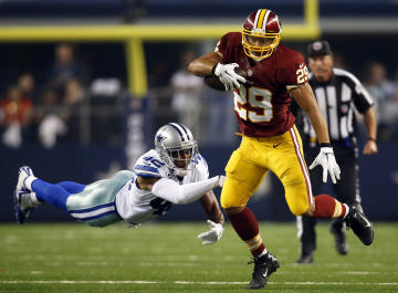 Roy Helu carries the ball last season with the Redskins. (AP Photo/Tim Sharp)