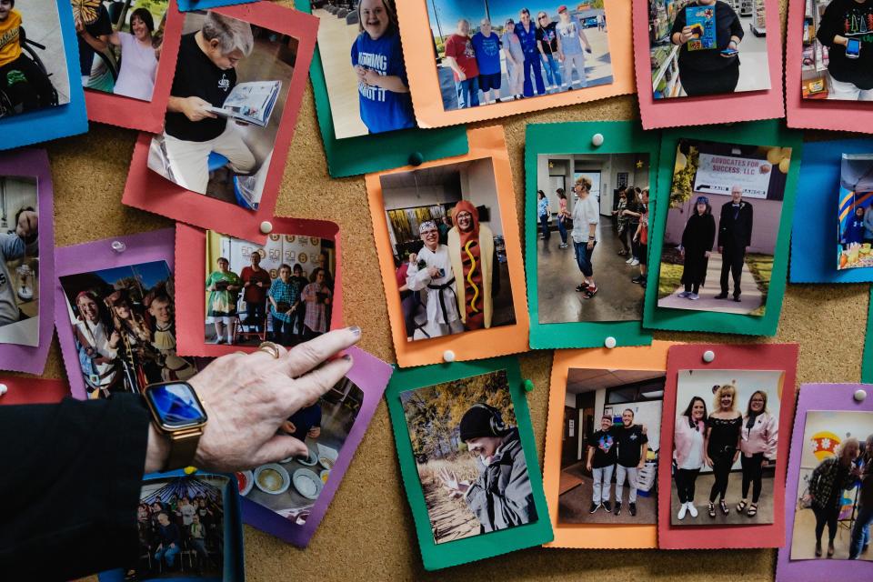 A picture of Jehred Bennett, 20, in a karate outfit at center, is seen among fellow attendees of Advocates For Success in New Philadelphia.