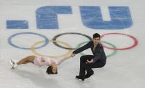 Meagan Duhamel and Eric Radford of Canada compete during the Team Pairs Short Program at the Sochi 2014 Winter Olympics, February 6, 2014. REUTERS/David Gray (RUSSIA - Tags: SPORT FIGURE SKATING OLYMPICS)