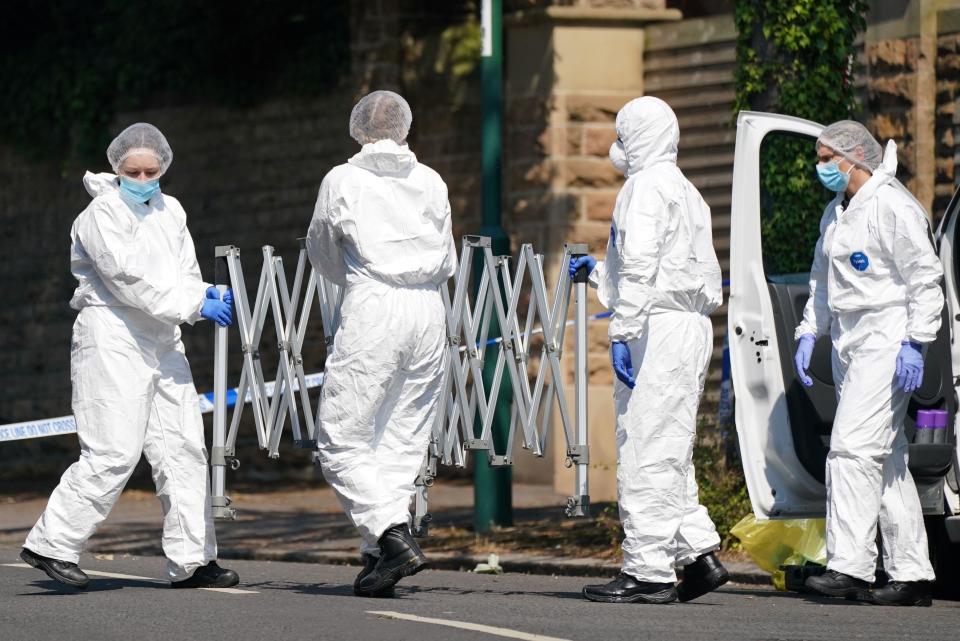 Police forensics officers on Magdala road, Nottingham, as a 31-year-old man has been arrested on suspicion of murder after three people were killed in Nottingham city centre early on Tuesday morning. Picture date: Tuesday June 13, 2023.