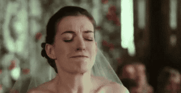 Bride with a veil, emotional at her wedding ceremony, tears in her eyes