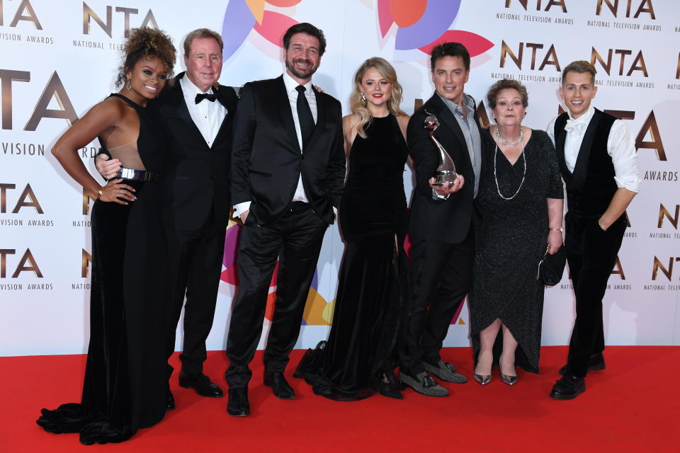 Fleur East, Harry Redknapp, Nick Knowles, Emily Atack, John Barrowman, Anne Hegerty, James McVey, and Scarlett Moffatt with the Bruce Forsyth award for Entertainment in the Press Room at the National Television Awards 2019 held at the O2 Arena, London. Photo credit should read: Doug Peters/EMPICS
