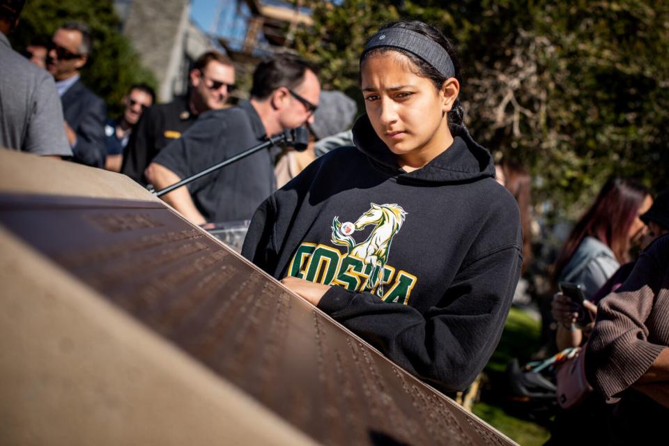 Maya Shivpuri,14, of Manhattan Beach, reads the words on the new monument at Bruce's Beach