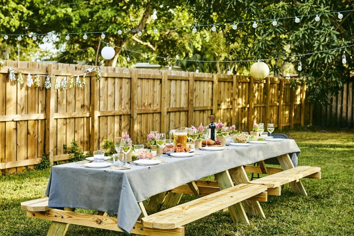 Place setting on dining table in back yard