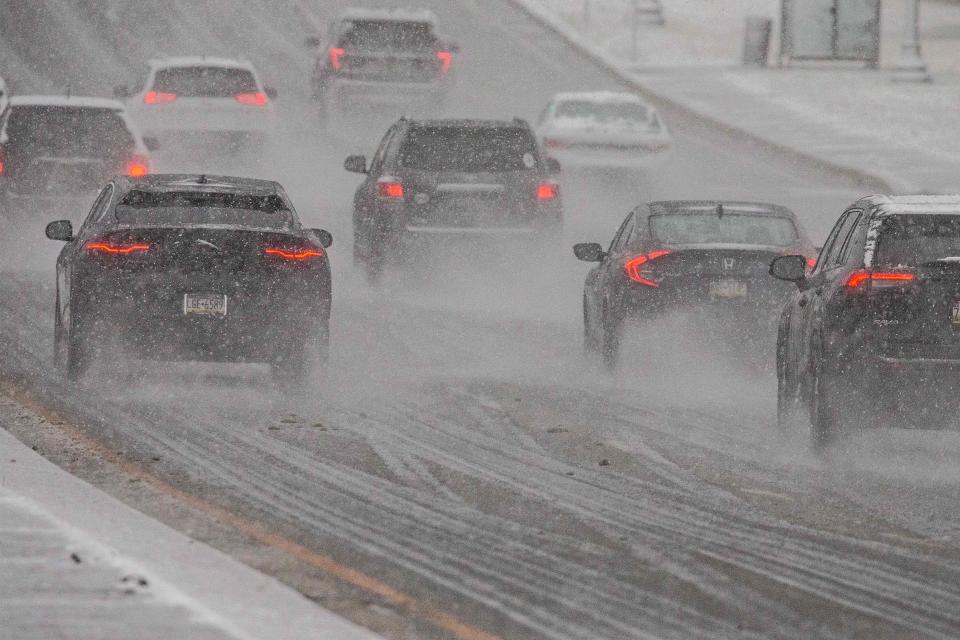 Drivers face a messy commute along Concord Pike as a combination of rain and snow falls during the early morning hours in Wilmington, Tuesday, Feb. 13, 2024.