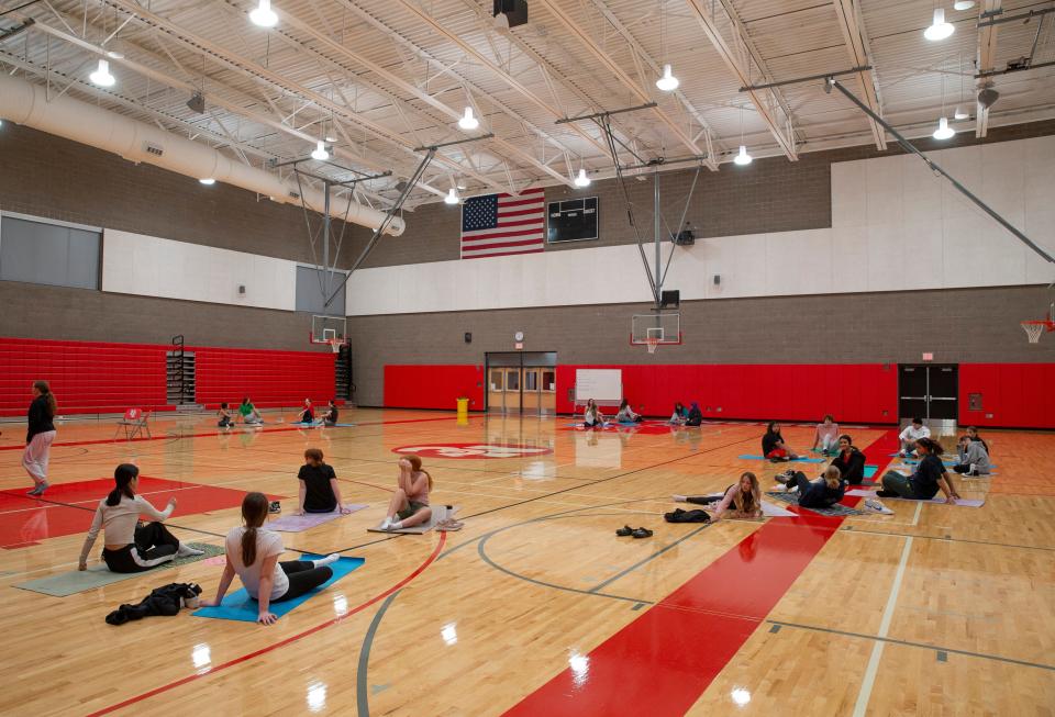 Students gather for a yoga class at the main gym at the new North Eugene High School.