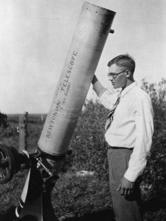 Tombaugh, pictured in June 1930 with his homemade 9in telescope (Popular Science Monthly)