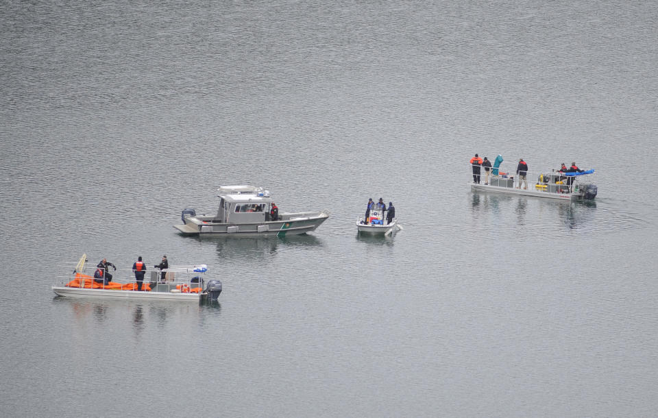 This photo released by Ouray County, shows salvage operations to recover the victims and plane, Thursday March 27, 2014, at the Ridgway Reservoir near Ridgway, Colo., at the site of a downed aircraft, which crashed last Saturday, March 22, 2014, killing five people from Alabama. (AP Photo/Ouray County, William Woody)