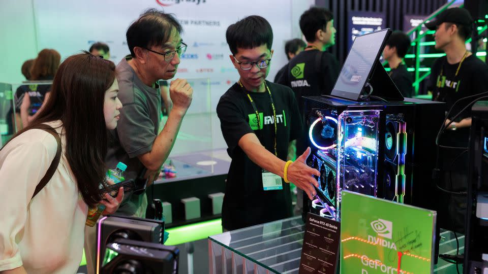 Staff introduce Nvidia GeForce series equipment on display at Computex in Taipei, Taiwan, on June 5. - Ann Wang/Reuters
