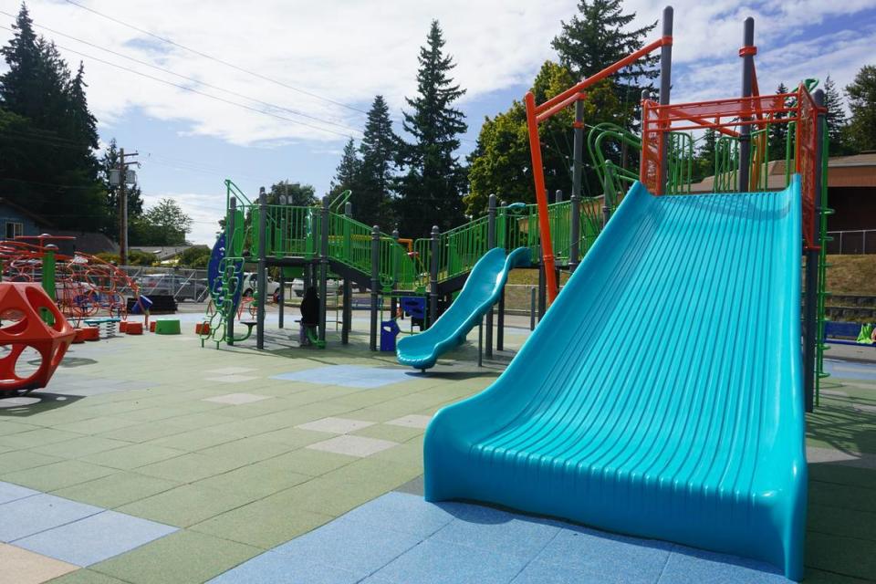 The slides at the new inclusive playground at Silver Beach Elementary School have wider bases at the bottom to support a safer landing. The new playground was completed on Aug. 28. 2023, in Bellingham, Wash. Rachel Showalter/The Bellingham Herald