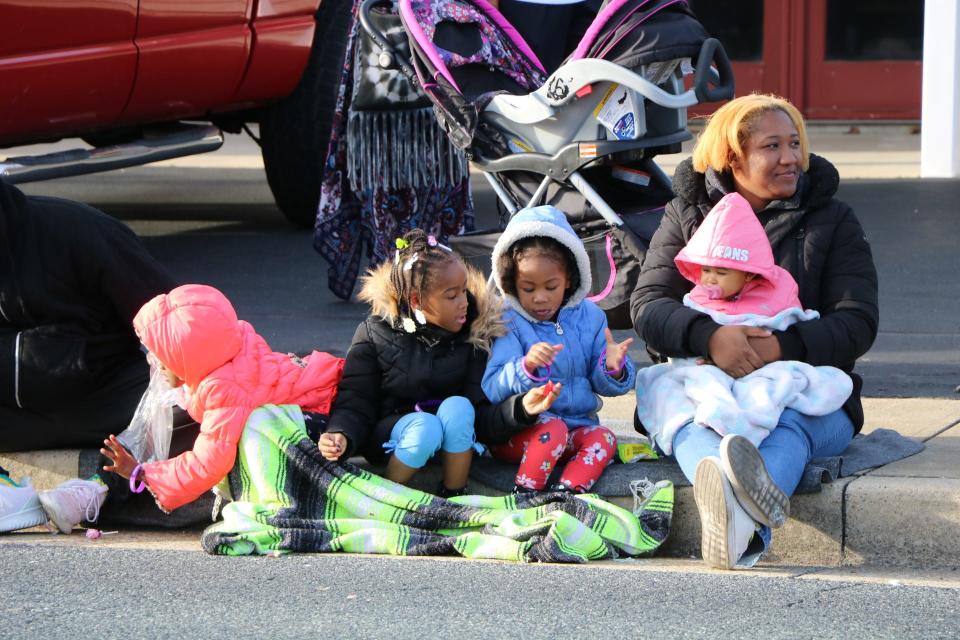 A group of onlookers enjoy the parade floats as they pass by during the 73rd annual Salisbury Jaycees Christmas Parade on Dec. 8, 2019 in Salisbury.