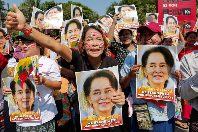 People gather to rally in support of Myanmar State Counsellor Aung San Suu Kyi before she attends a hearing at the International Court of Justice (ICJ), in Yangon