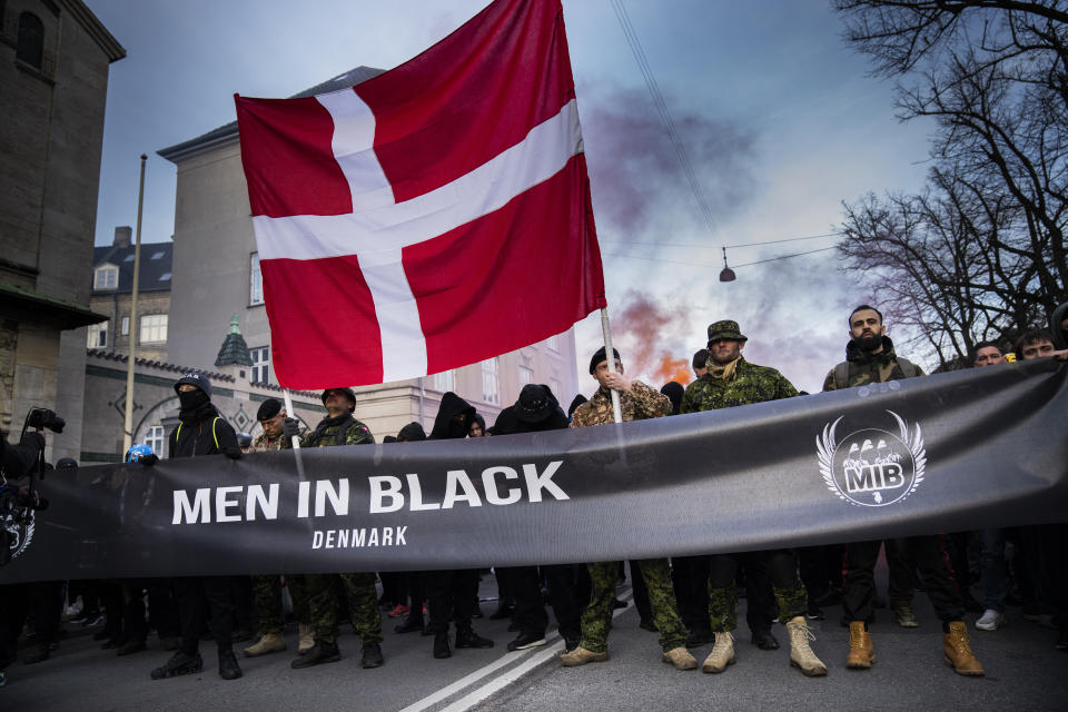 The group Men in Black protest in the streets of Copenhagen on Saturday, April 10, 2021. Men in Black were protesting about Denmark's COVID-19 restrictions. (Martin Sylvest/Ritzau Scanpix via AP)